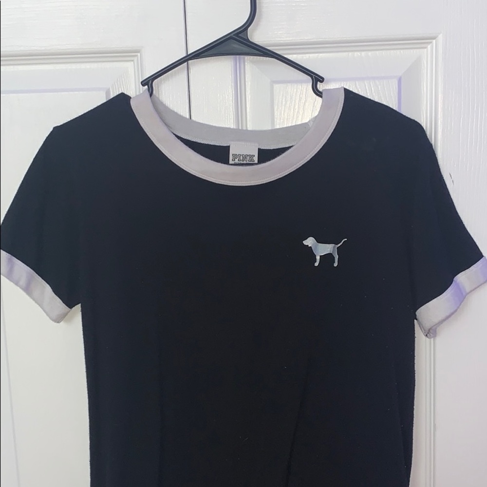 pink brand tee shirt with dog logo